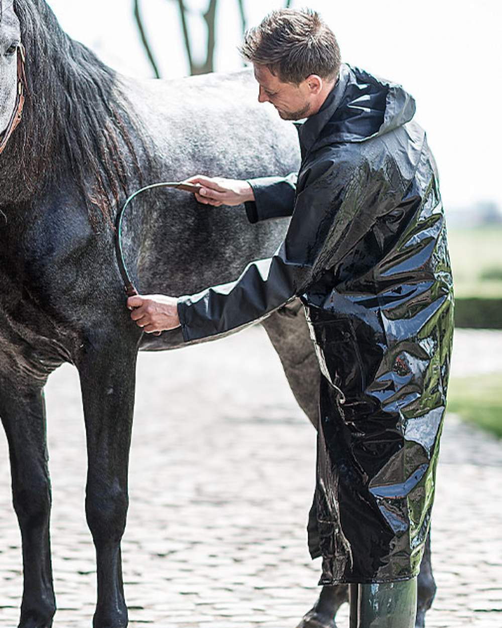 Green Khaki Coloured Baleno Helsinki Long Raincoat on stable background