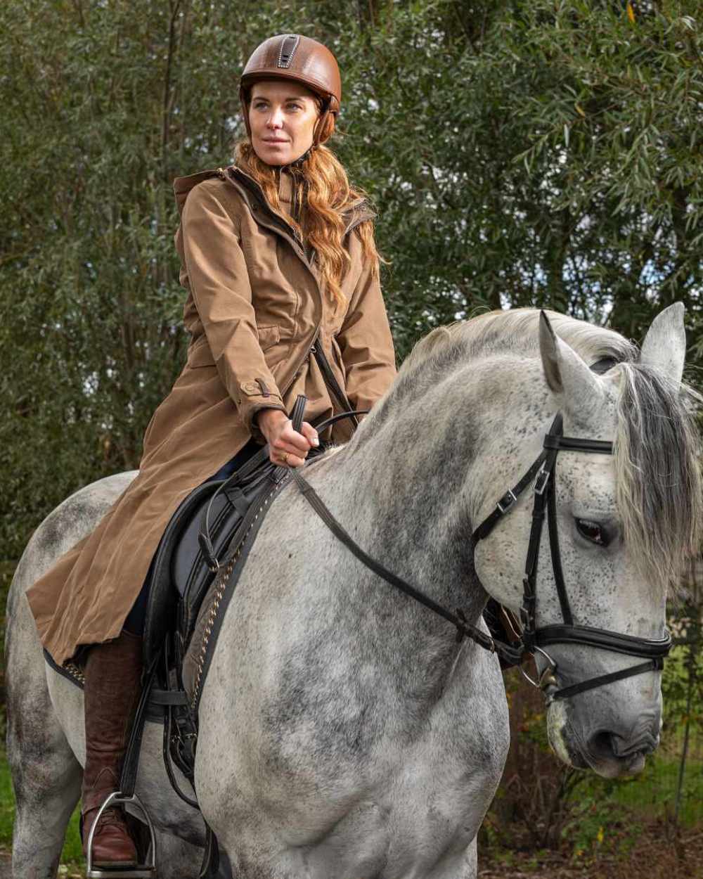 Camel Coloured Baleno Kensington Long Waterproof Coat on countryside background