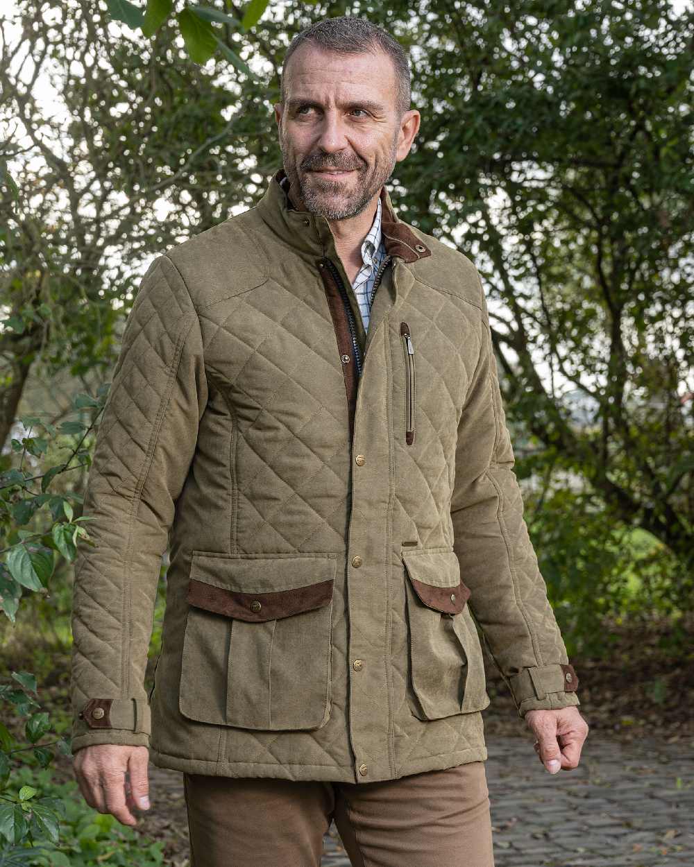Light Khaki coloured Baleno Mens Goodwood Quilted Jacket on countryside background