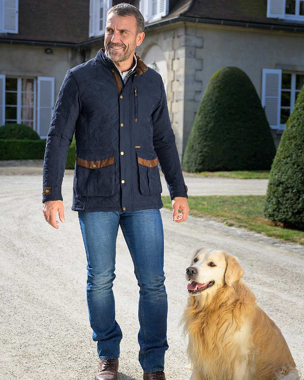 Navy Blue coloured Baleno Mens Goodwood Quilted Jacket on building background