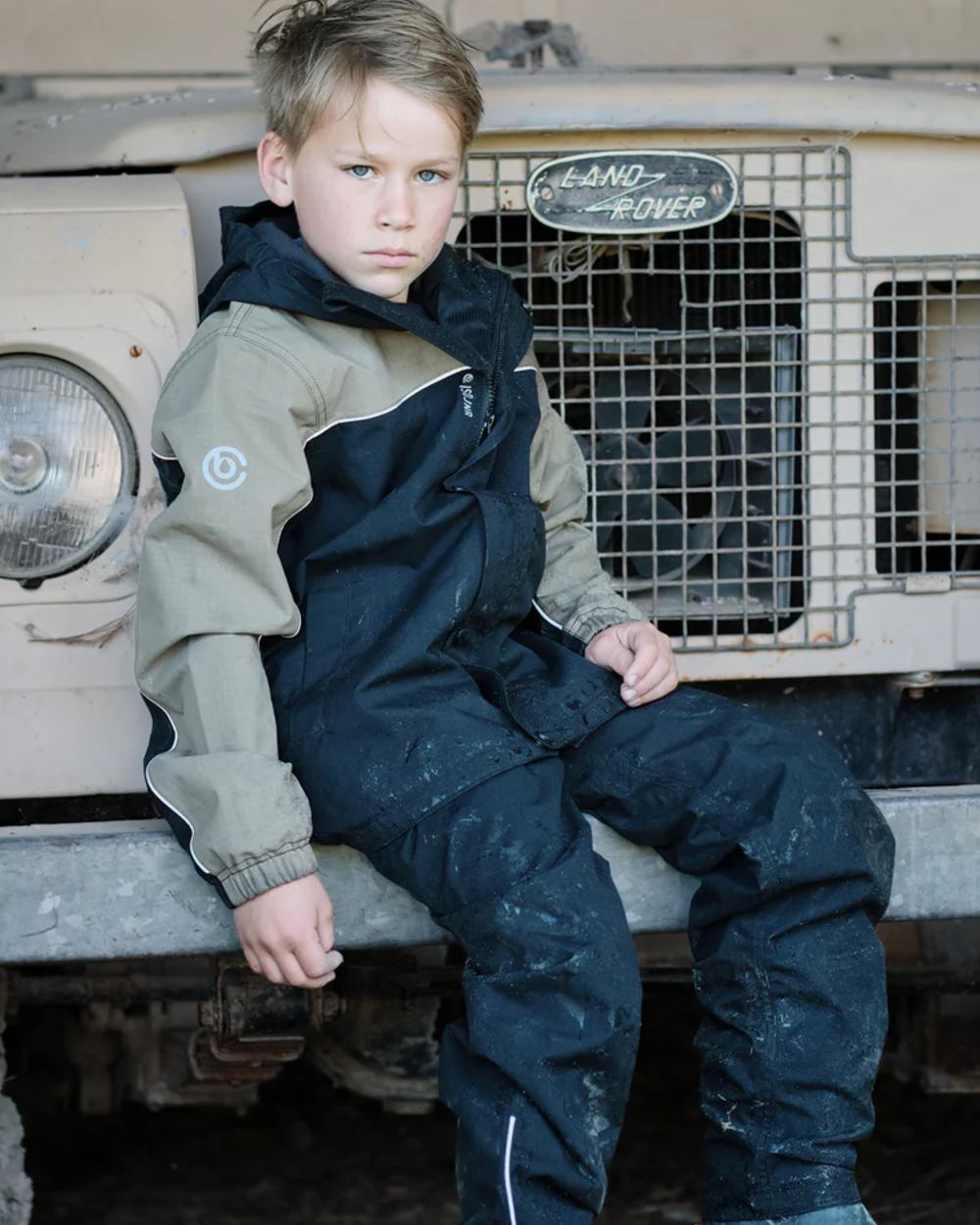 Black coloured Betacraft Childrens ISOJNR Bib Overtrousers on outdoor background