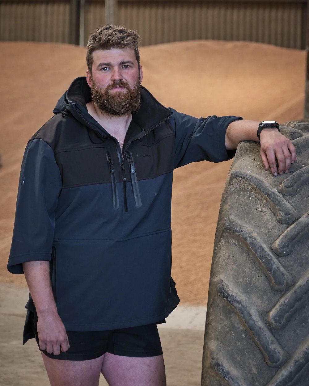 Navy coloured Betacraft Mens Husk Anorak on factory background