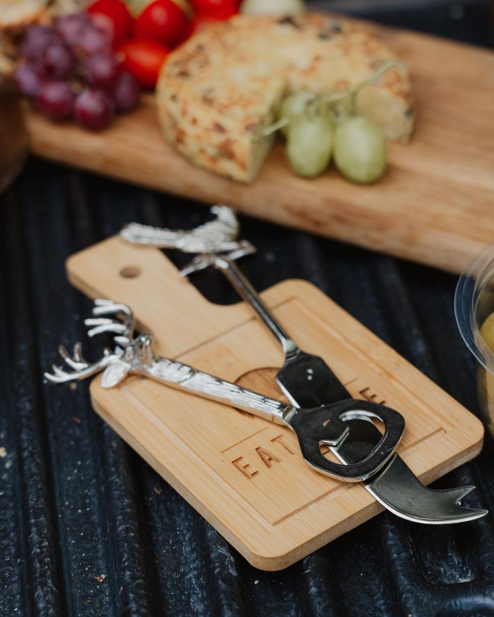 Bisley 3 Piece Stainless Steel Cheese Set on blurry background