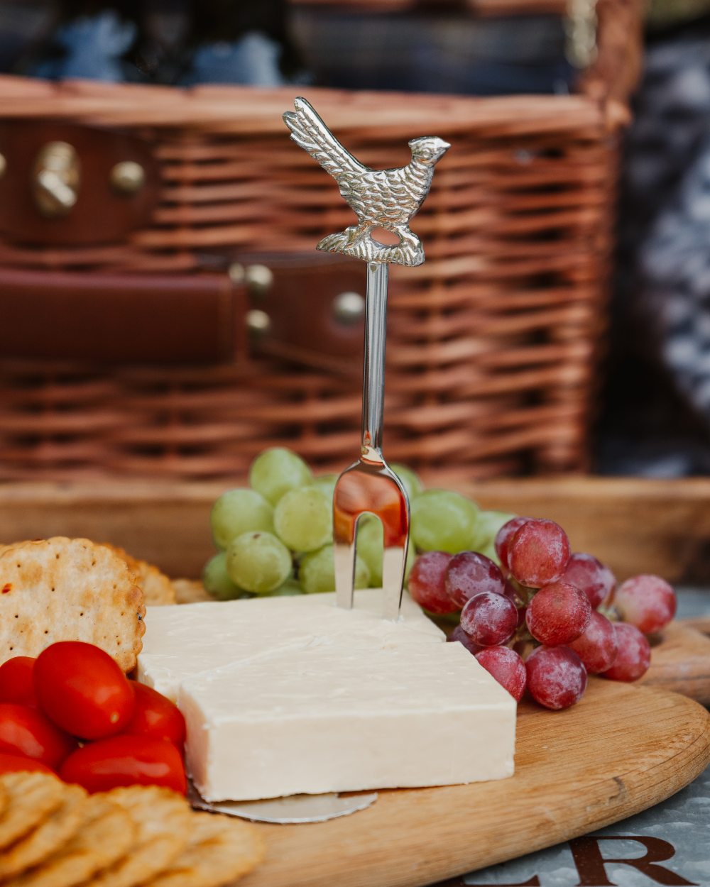 Bisley 3 Piece Stainless Steel Cheese Set on blurry background