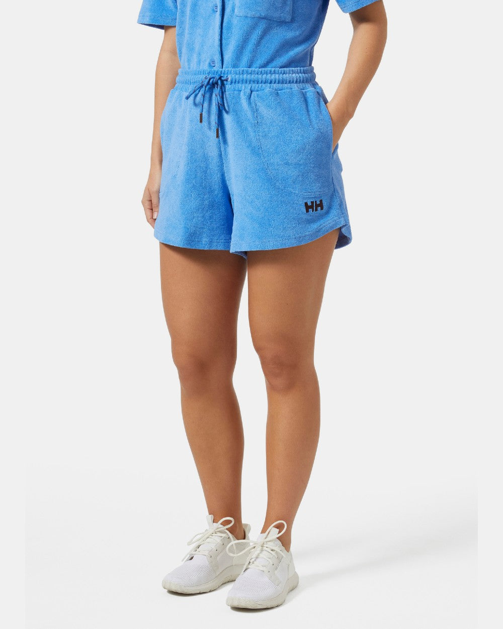 Ultra Blue coloured Helly Hansen womens siren towelling shorts on grey background