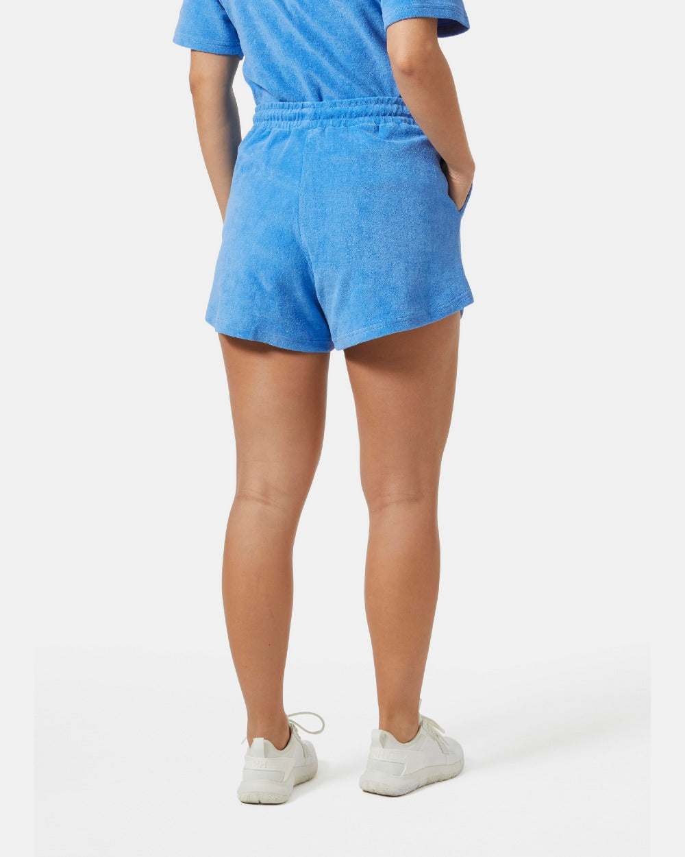 Ultra Blue coloured Helly Hansen womens siren towelling shorts on grey background