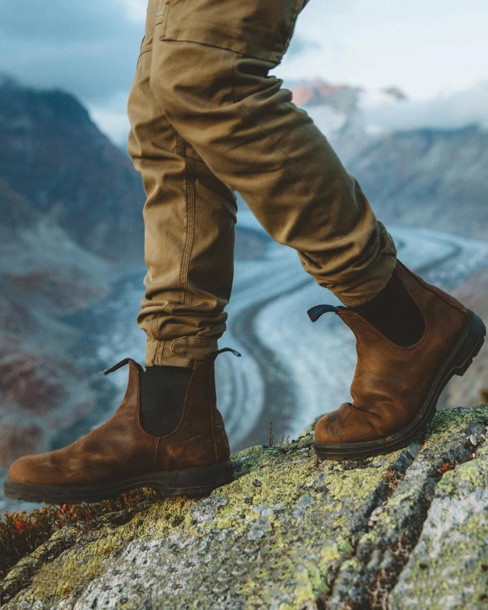 Antique Brown coloured Blundstone 1477 Antique Brown Waterproof Boots on mountain background