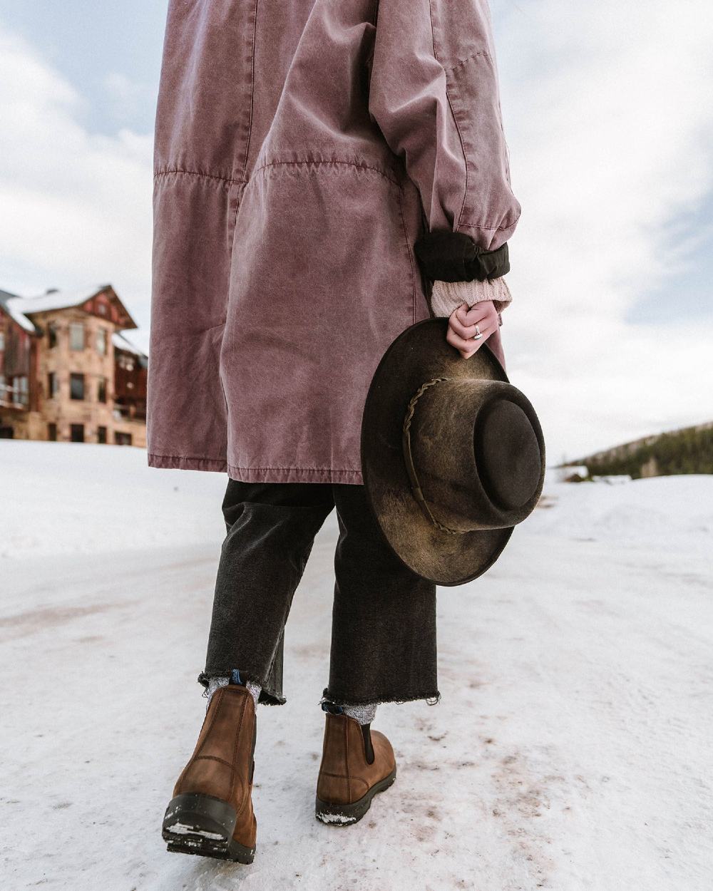 Antique Brown coloured Blundstone 1477 Antique Brown Waterproof Boots on snow background