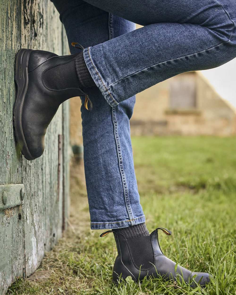 Black Coloured Blundstone 2058 Black Chelsea Boots on outdoor background