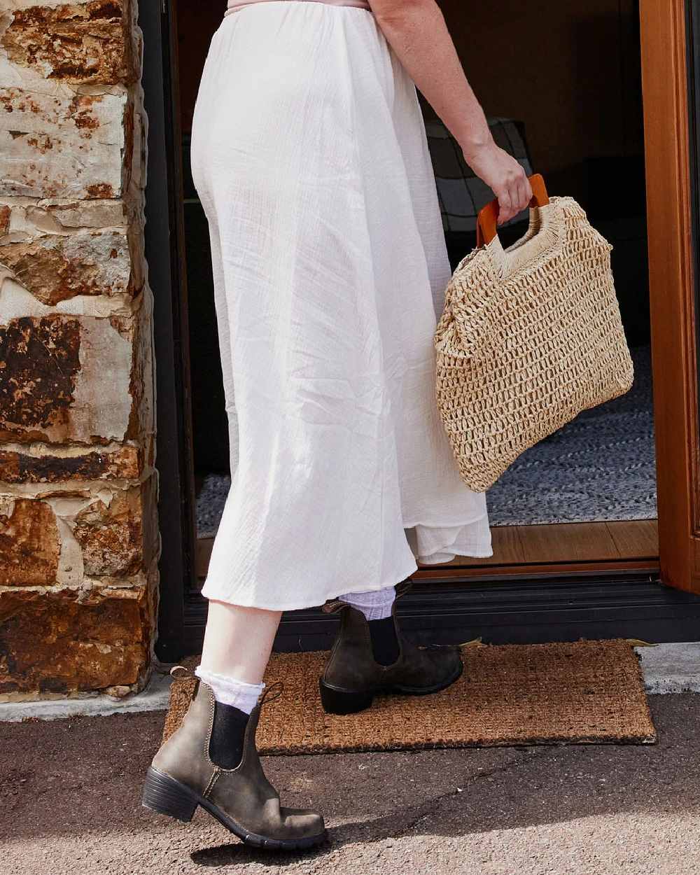 Rustic Brown coloured Blundstone Womens 1677 Leather Boots on house background