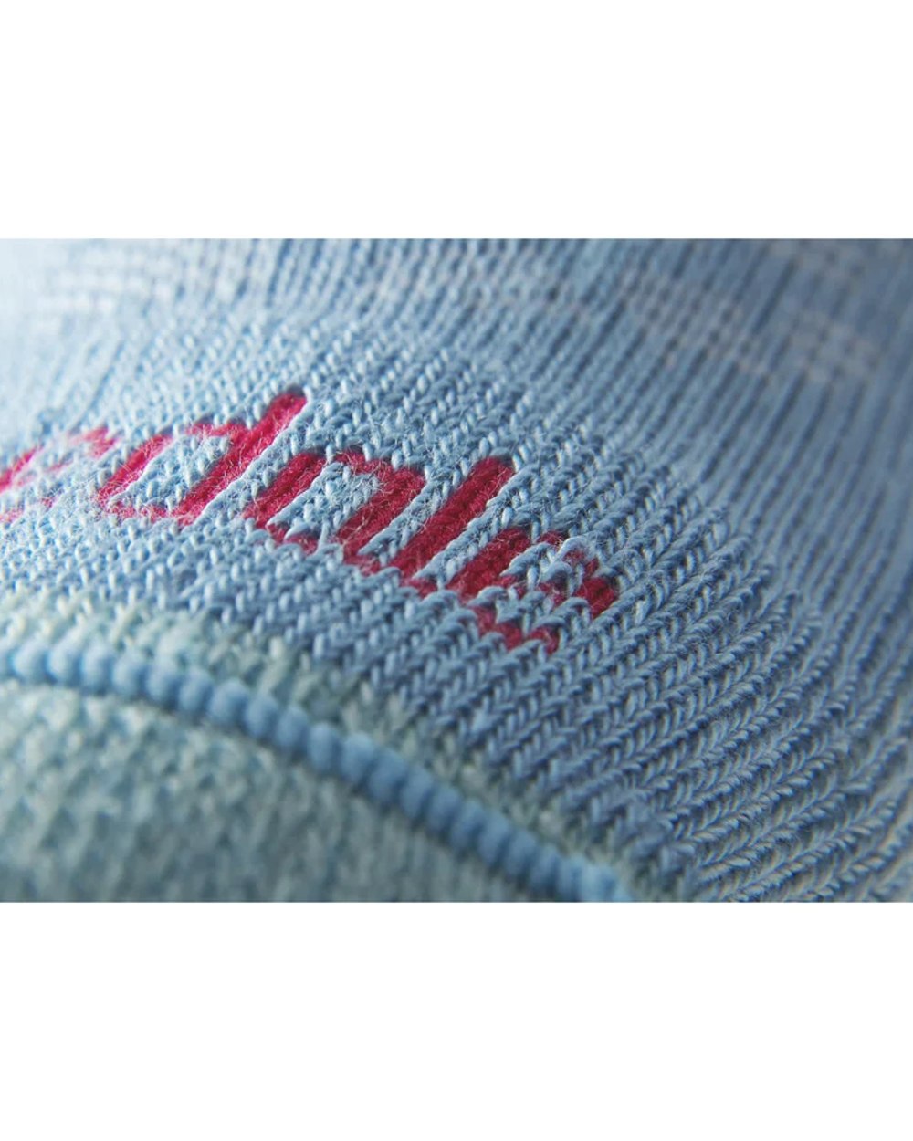 Close up Powder Blue coloured Bridgedale Womens Lightweight Merino Comfort Boot Socks on a white background
