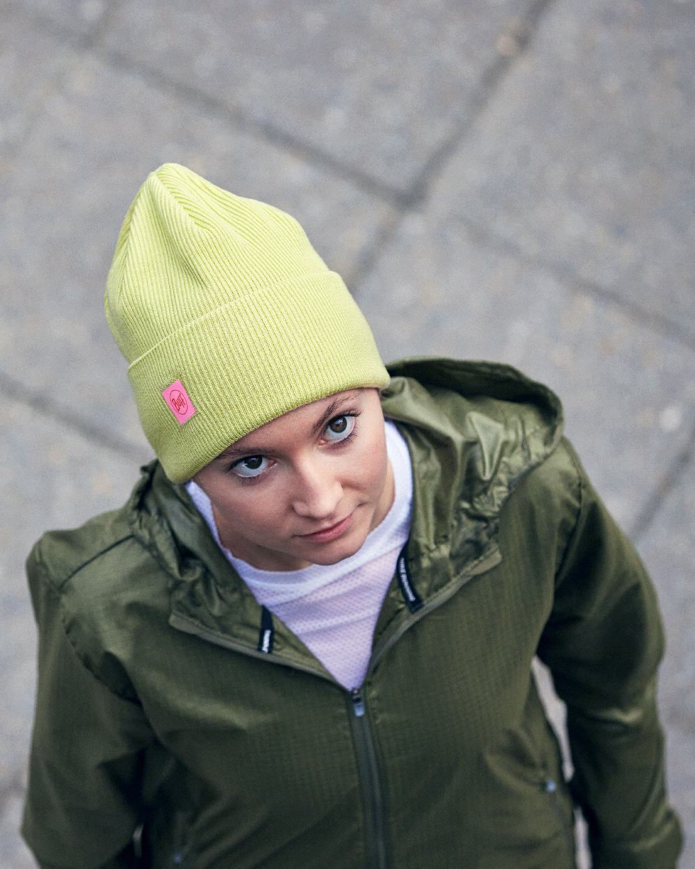 Sheen Yellow Coloured Buff CrossKnit Beanie on street background