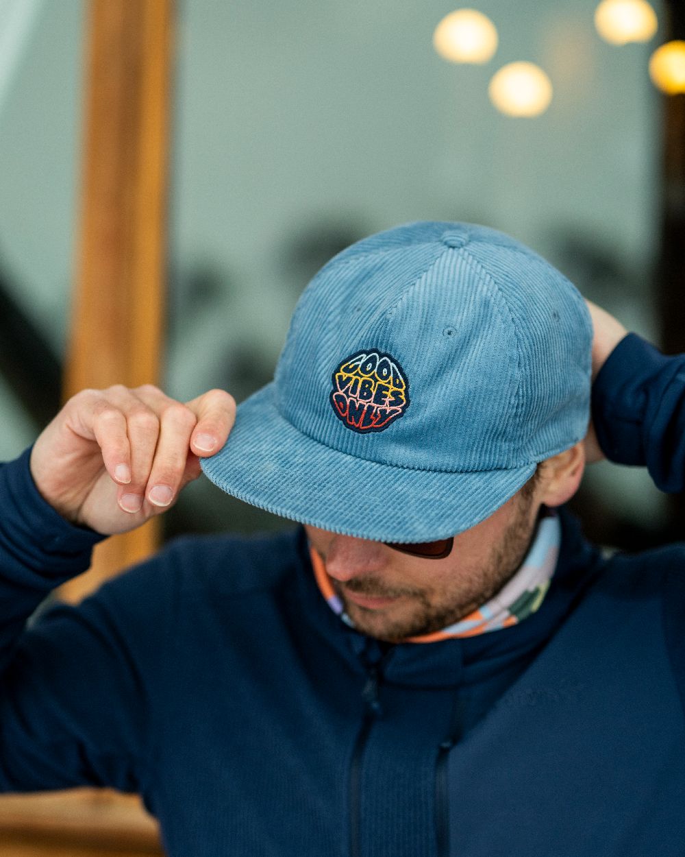 Water Coloured Buff Dister Chill Trucker Cap on blurry background
