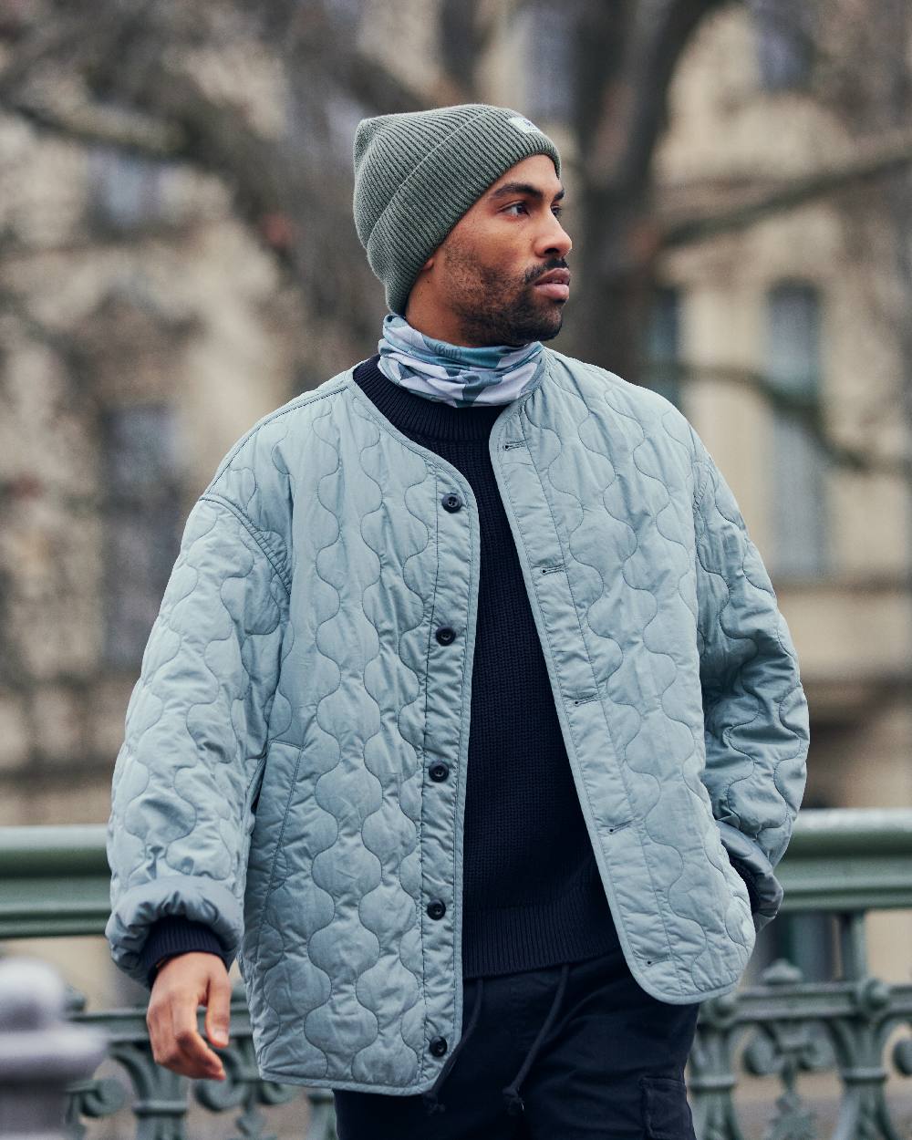 Silversage Coloured Buff Drisk Knitted Beanie on blurry background