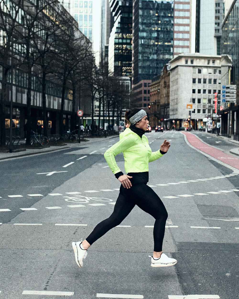 Light Grey Coloured Buff DryFlx Headband on street background