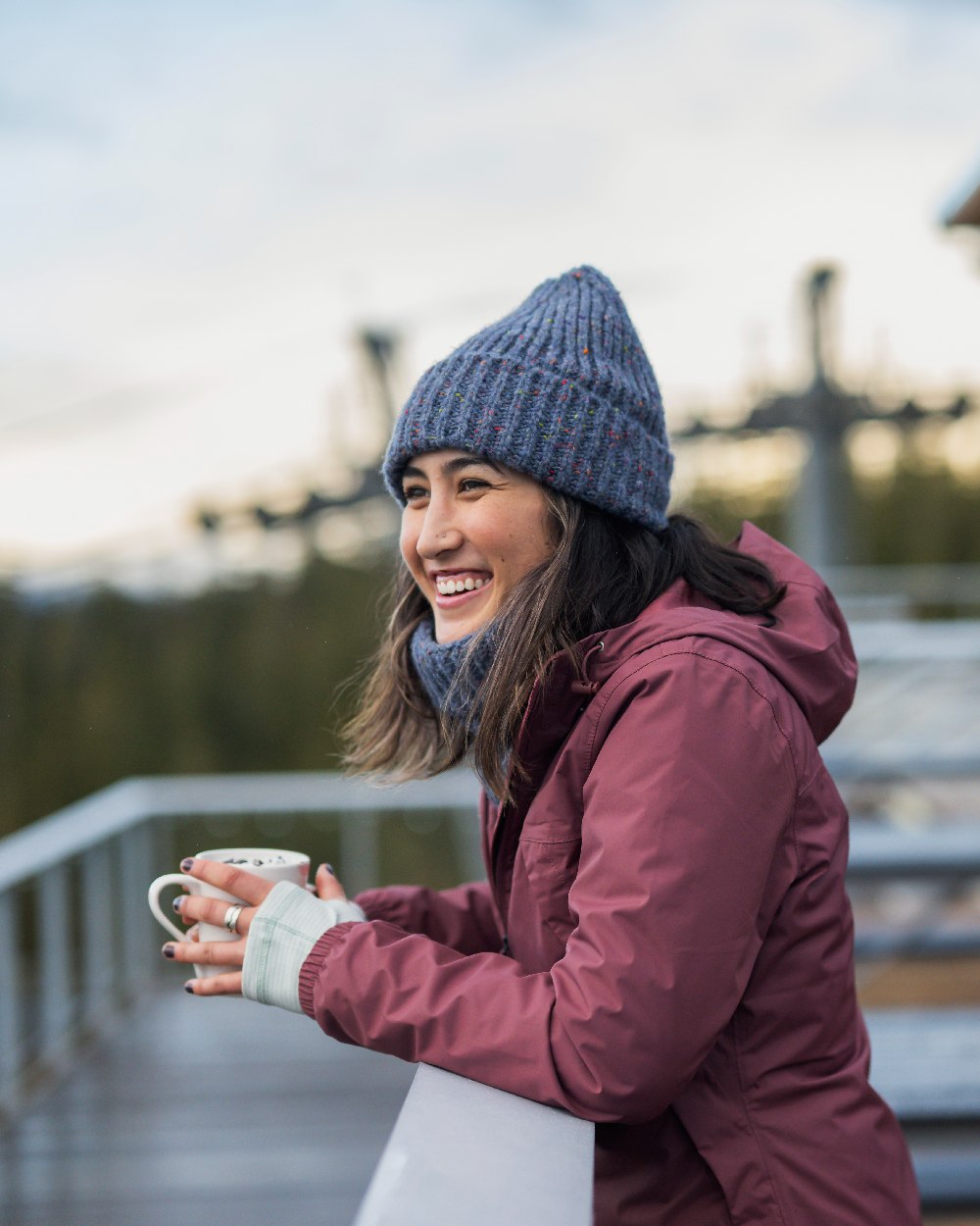 Water Coloured Buff Kim Knitted Fleece Beanie on blurry background