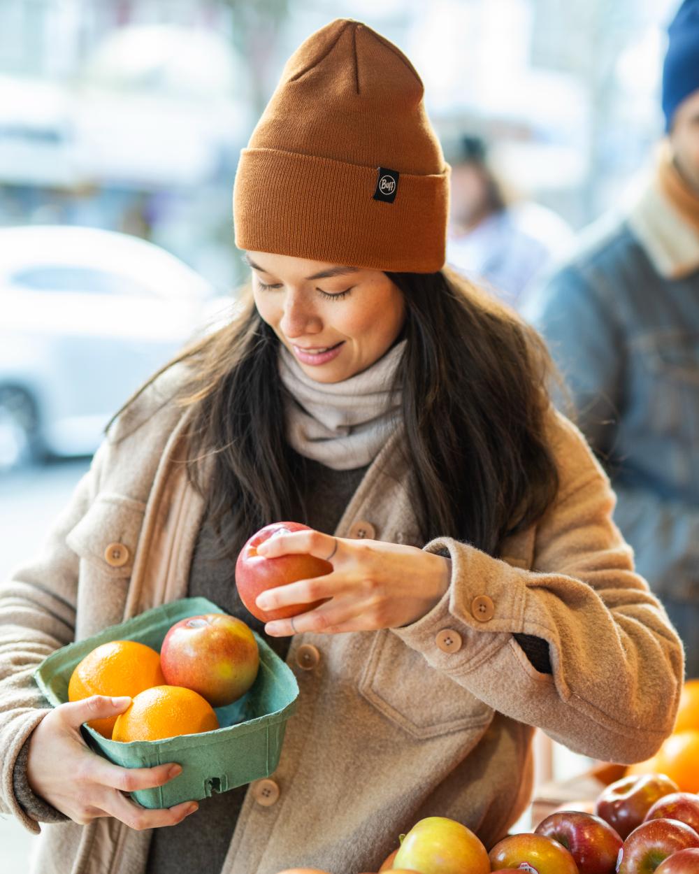Copper Coloured Buff Linon Knitted Beanie on blurry background