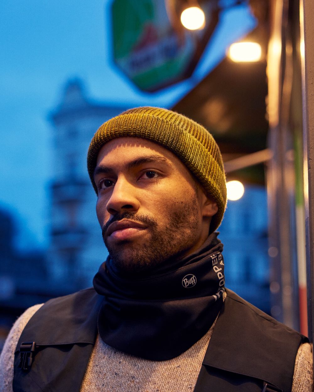 Logo Black Coloured Buff Windproof Neckwear on blurry background