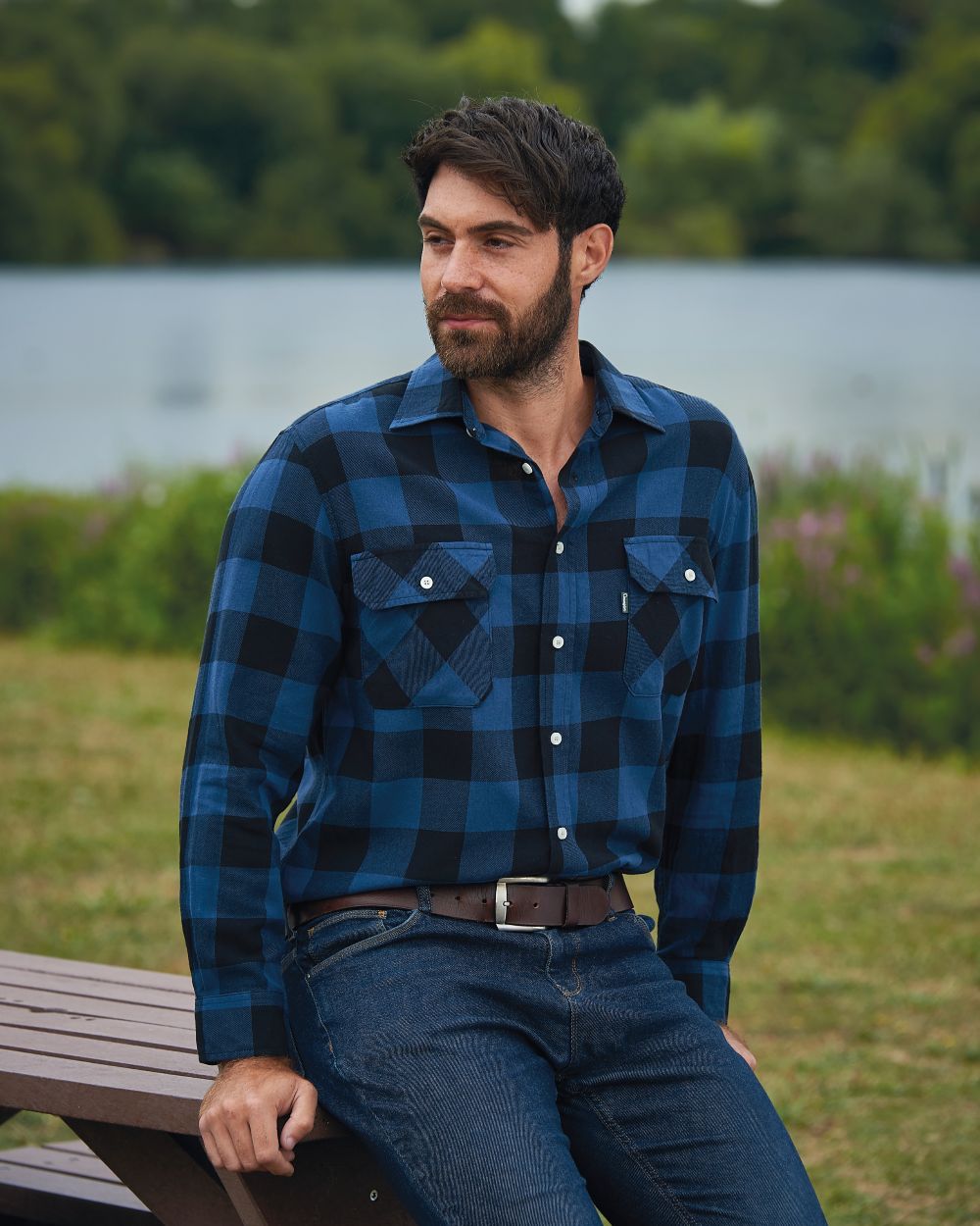 Blue coloured Champion Arran Long Sleeve Shirt on pond background