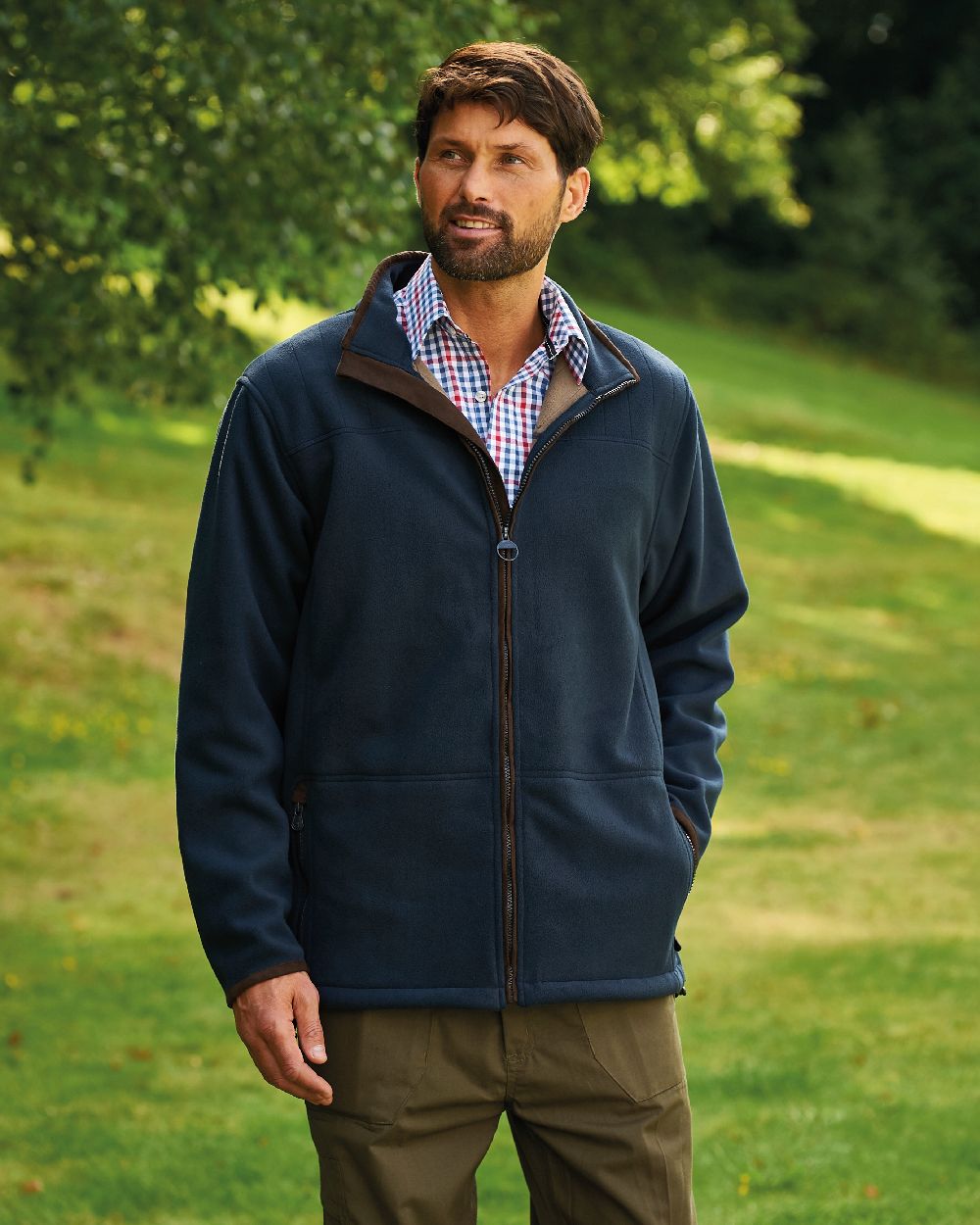 Navy coloured Champion Berwick Fleece Jacket on lawn background