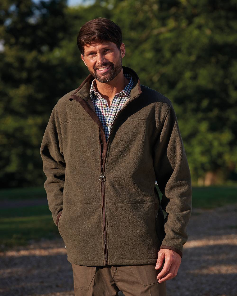 Olive coloured Champion Berwick Fleece Jacket on lawn background