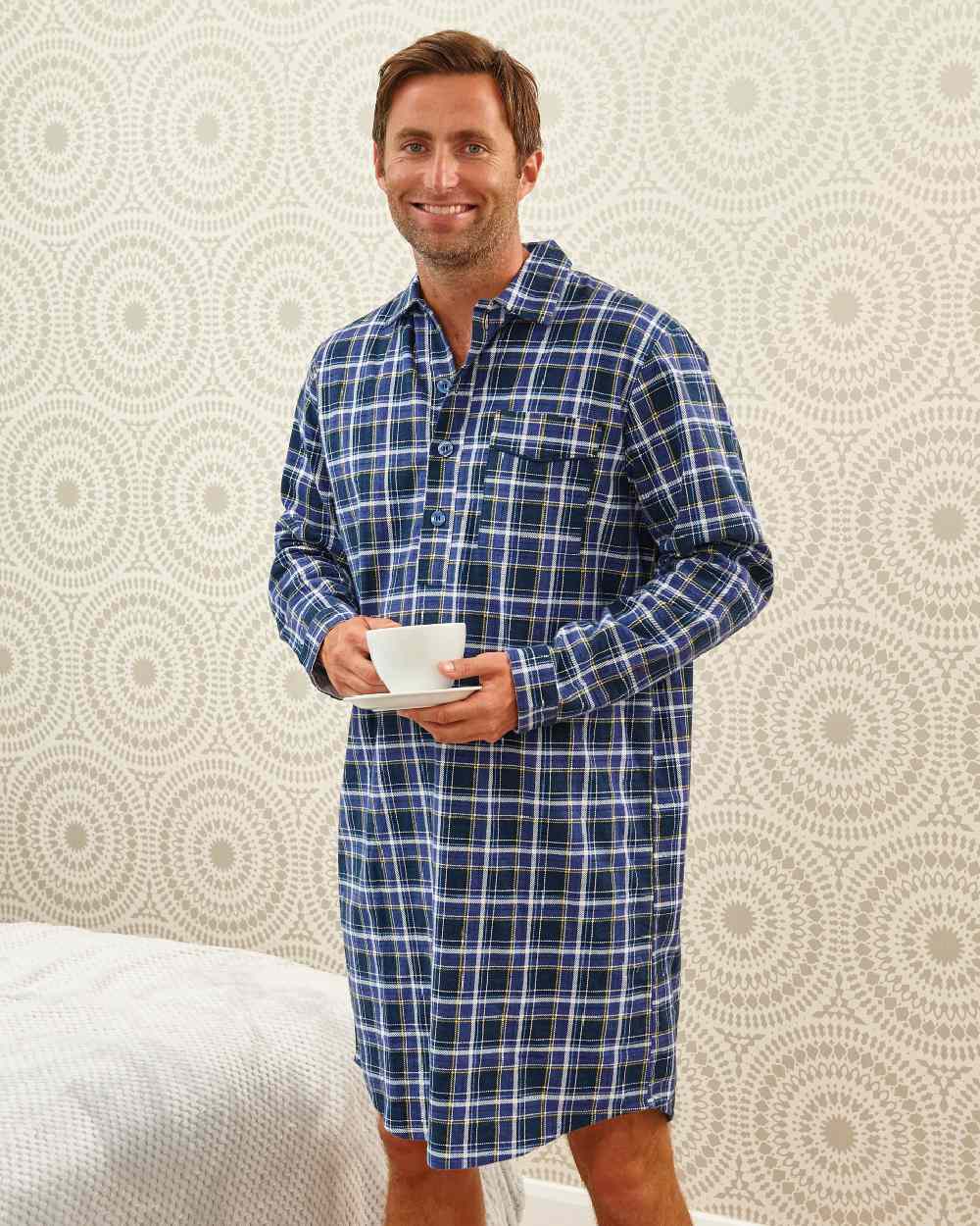 Blue coloured Champion Canterbury Cotton Nightshirt on wall background