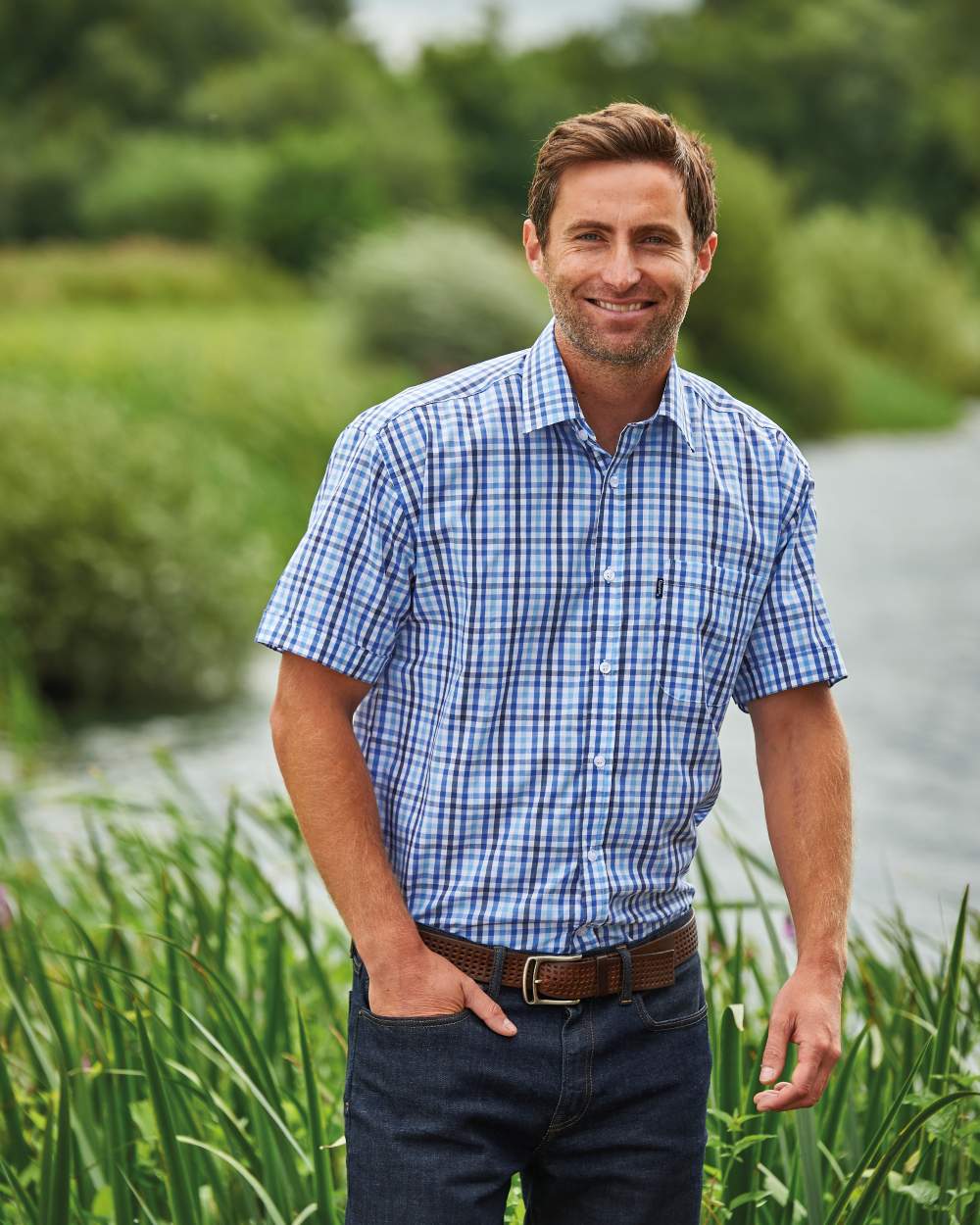 Light Blue coloured Champion Doncaster Short Sleeved Shirt on riverside background