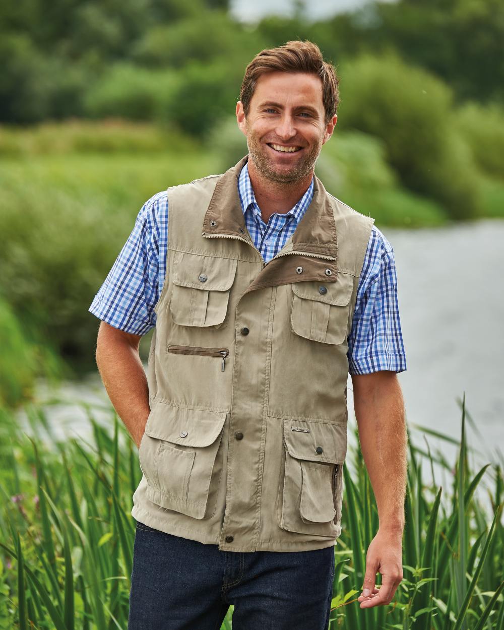 Stone coloured Champion Farnham Gilet on riverside background