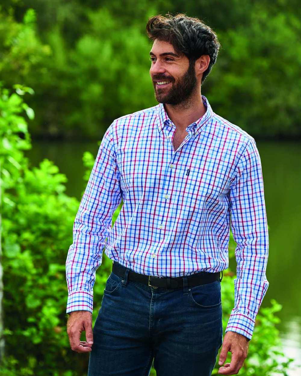 Blue coloured Champion Harrogate Long Sleeve Shirt on pond background