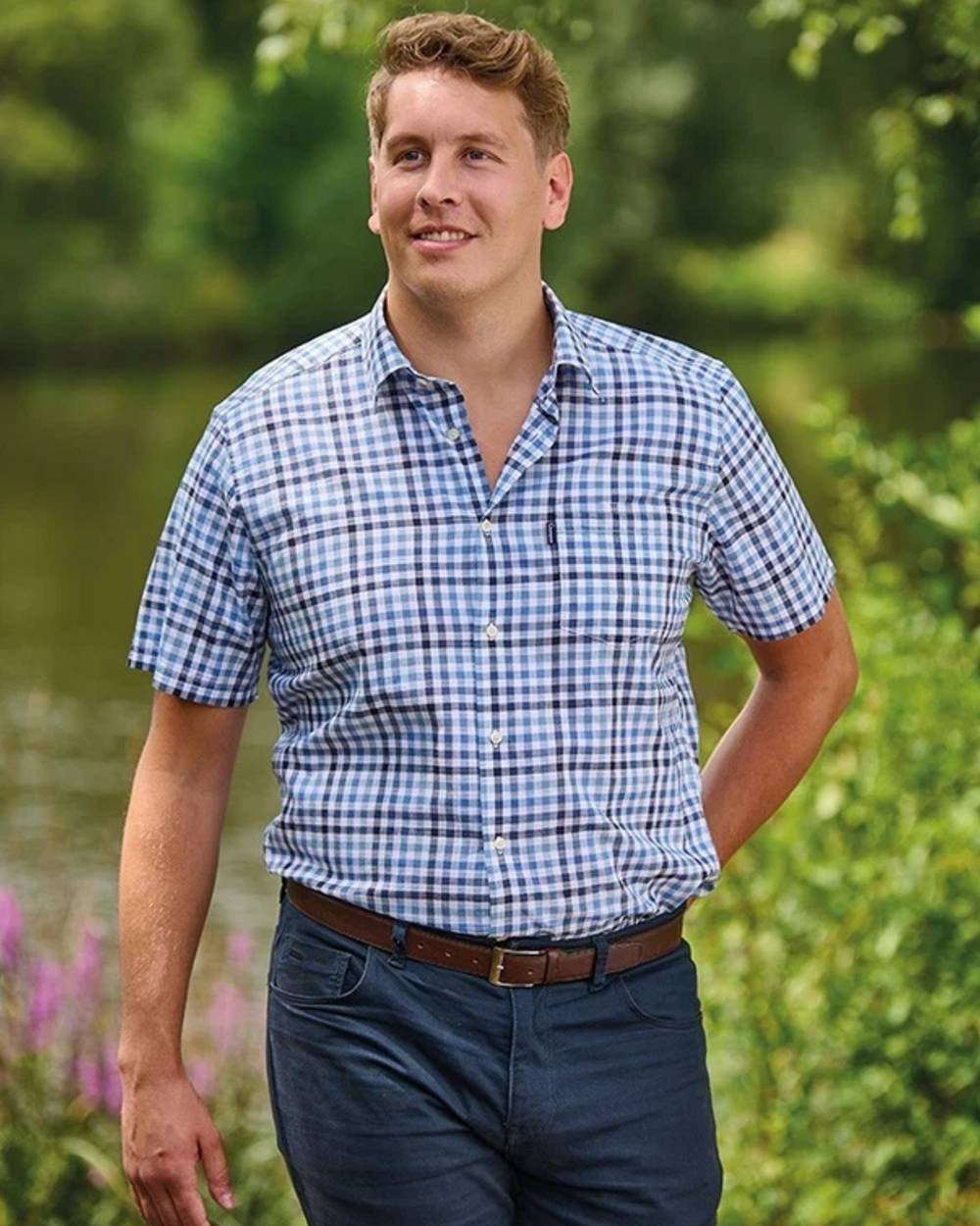 Blue coloured Champion Mens Broadstairs Short Sleeve Shirt on lake background