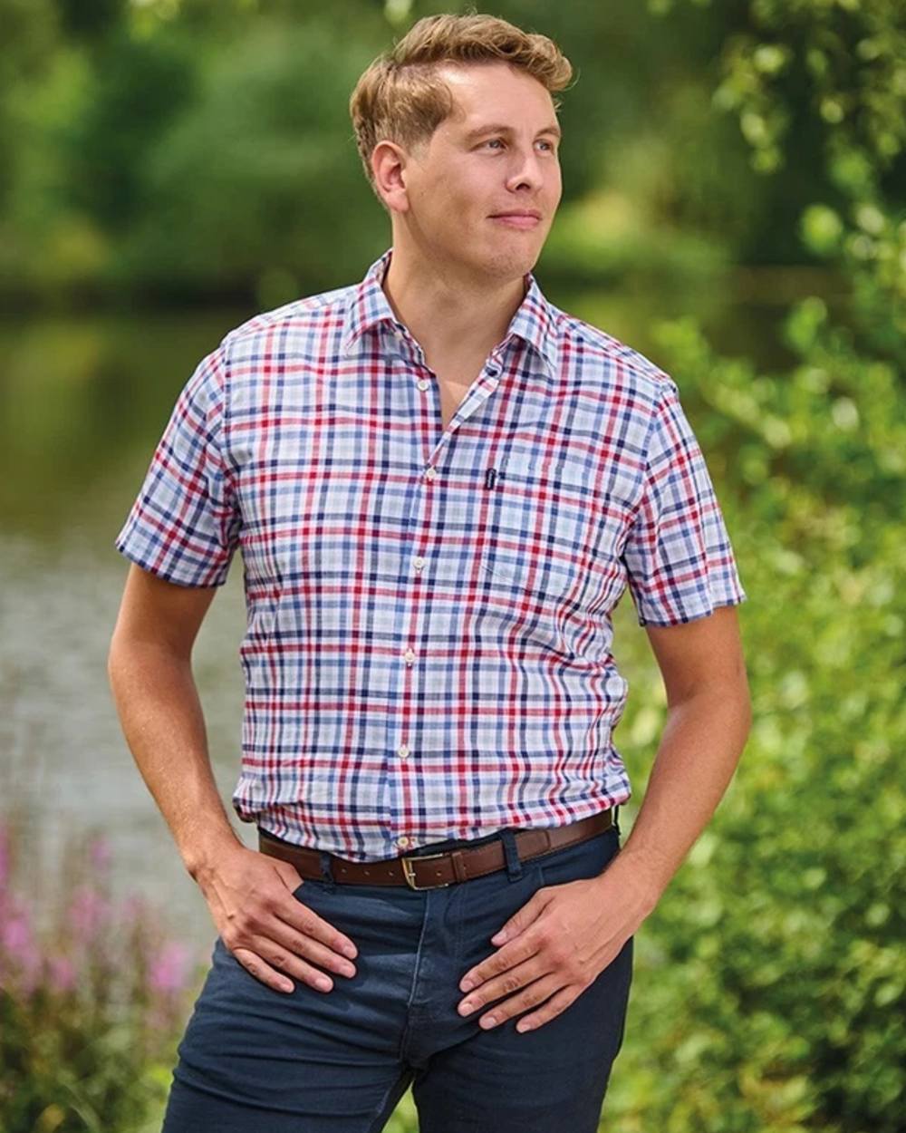 Red coloured Champion Mens Broadstairs Short Sleeve Shirt on lake background