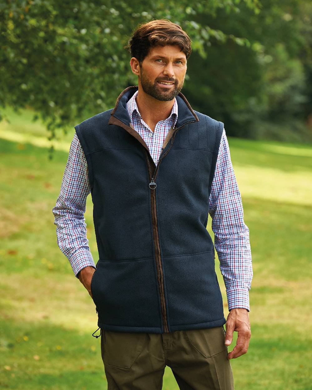 Navy coloured Champion Portree Fleece Gilet on lawn background