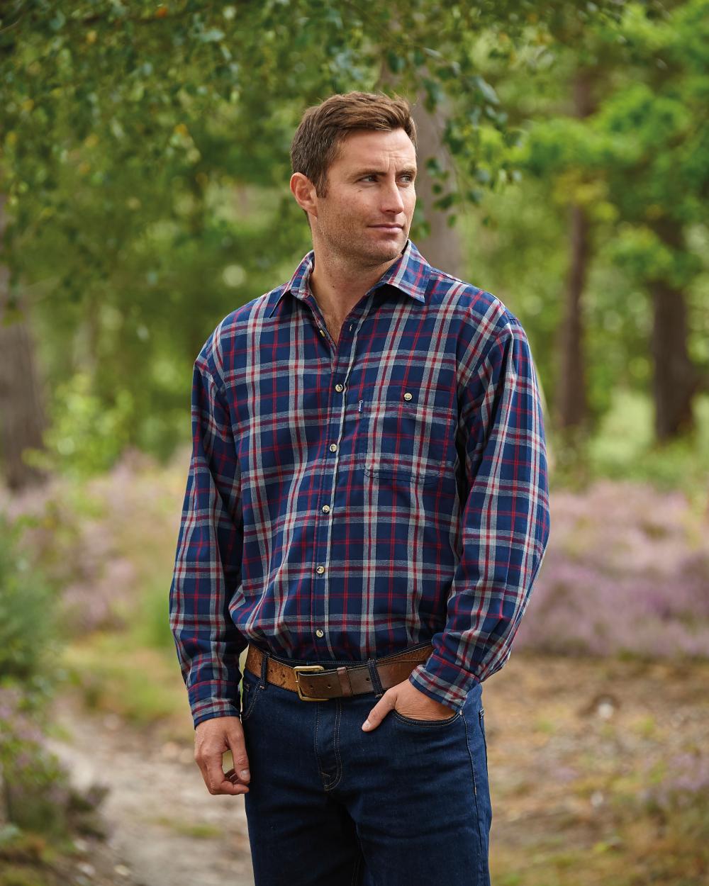 Blue coloured Champion Stroud Micro Fleece Lined Shirt on forest background