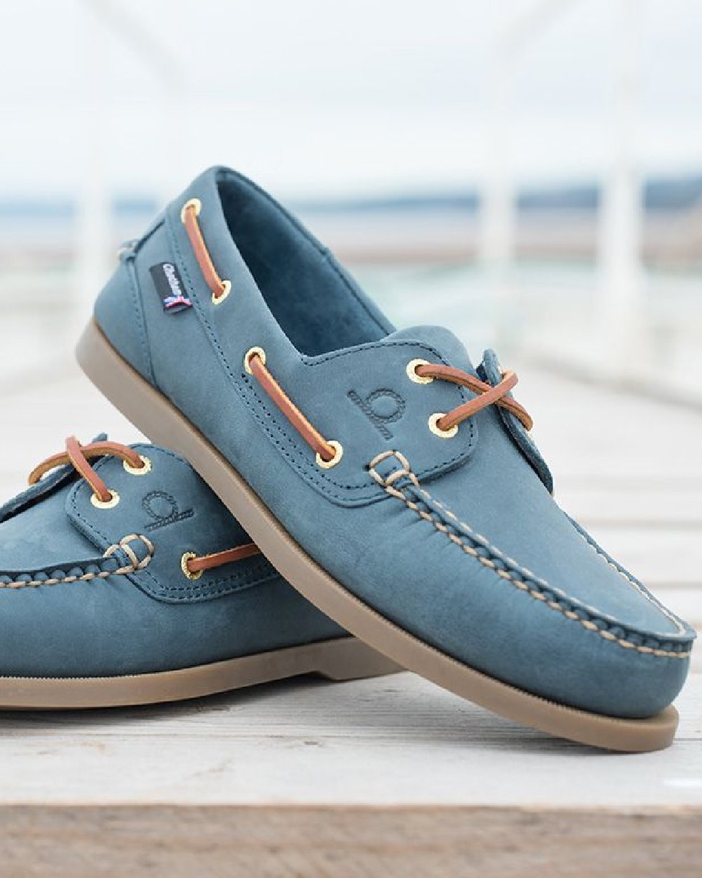 Blue Coloured Chatham Mens The Deck II G2 Premium Leather Boat Shoes on blurry background