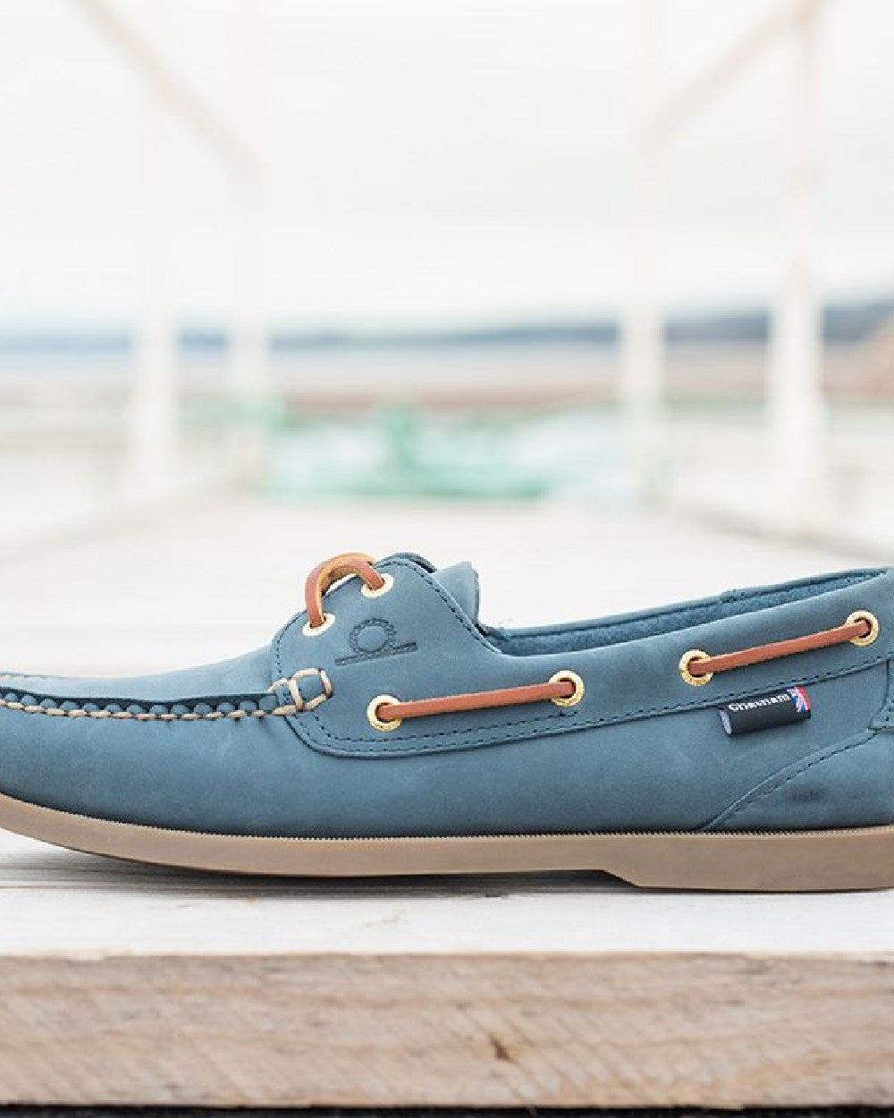 Blue Coloured Chatham Mens The Deck II G2 Premium Leather Boat Shoes on blurry background