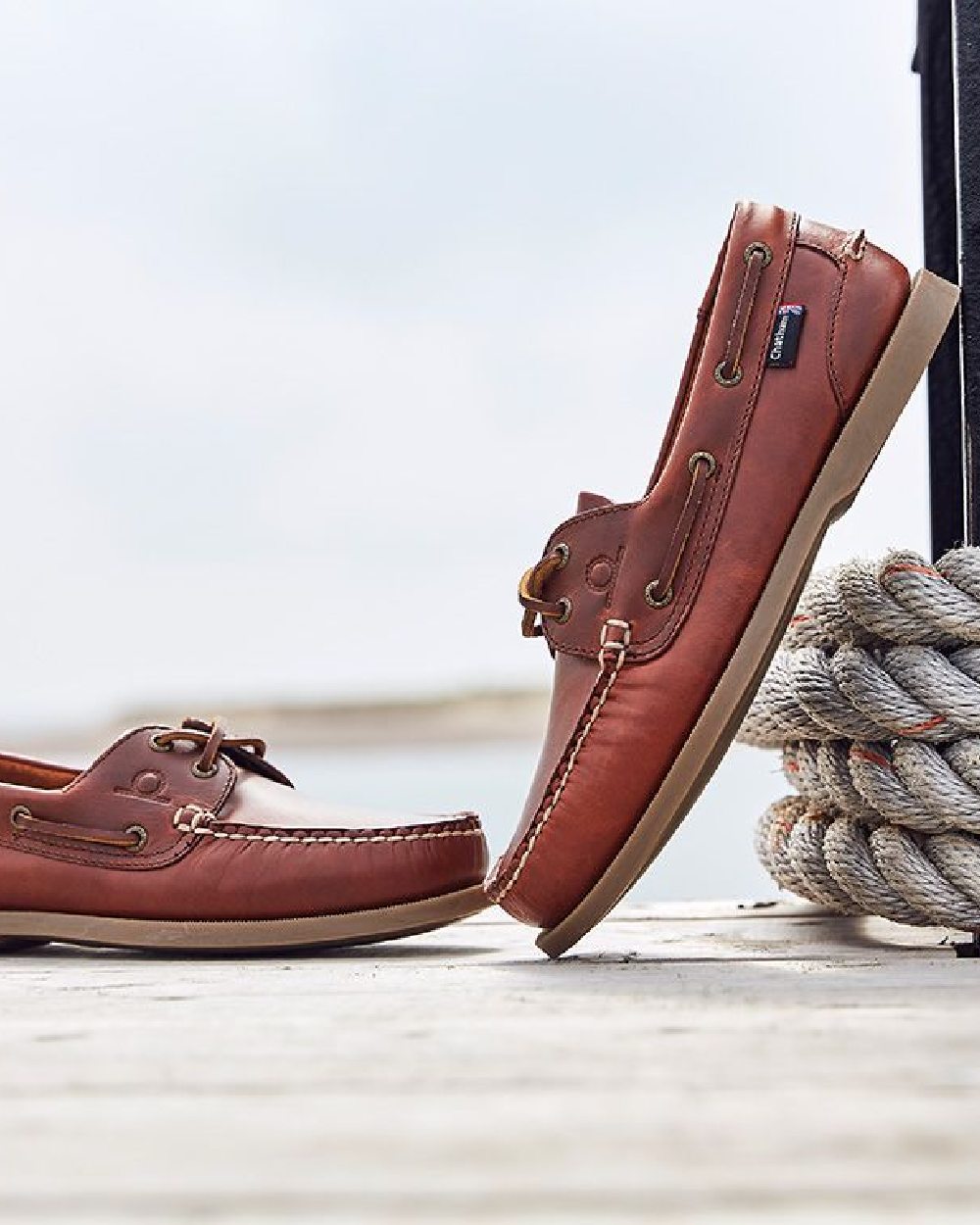 Chestnut Coloured Chatham Mens The Deck II G2 Premium Leather Boat Shoes on blurry background