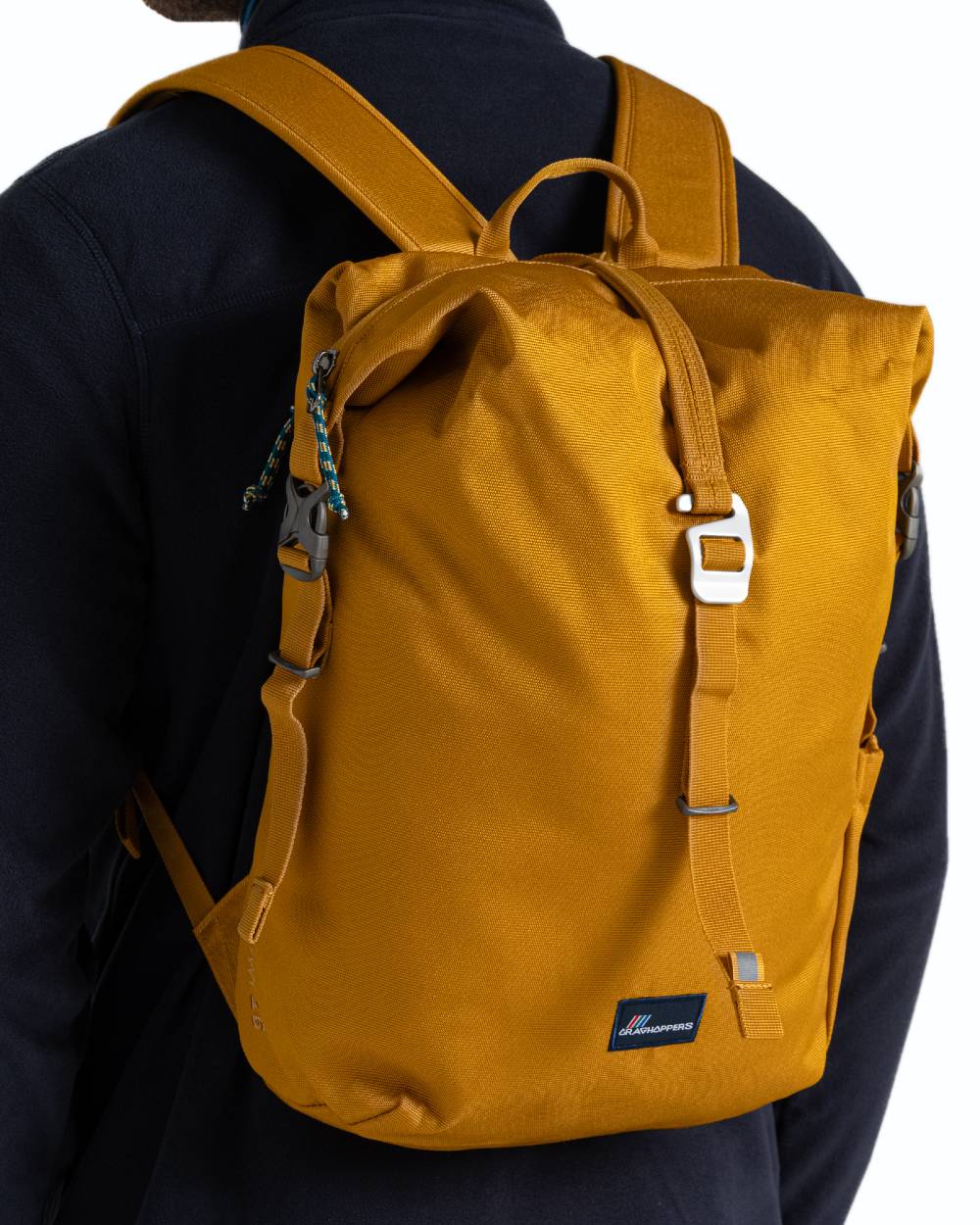 Dark Butterscotch coloured Craghoppers 16L Kiwi Classic Rolltop II Backpack on white background