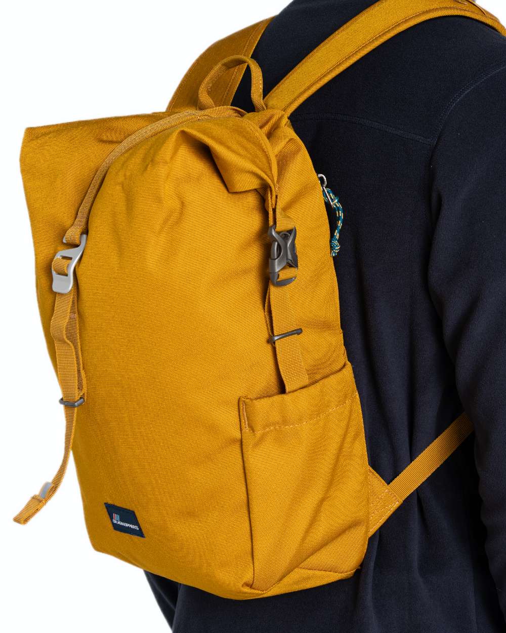 Dark Butterscotch coloured Craghoppers 16L Kiwi Classic Rolltop II Backpack on white background
