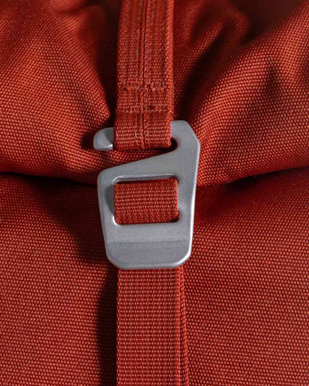 Red Beach coloured Craghoppers 20L Kiwi Classic Rolltop Backpack II on white background