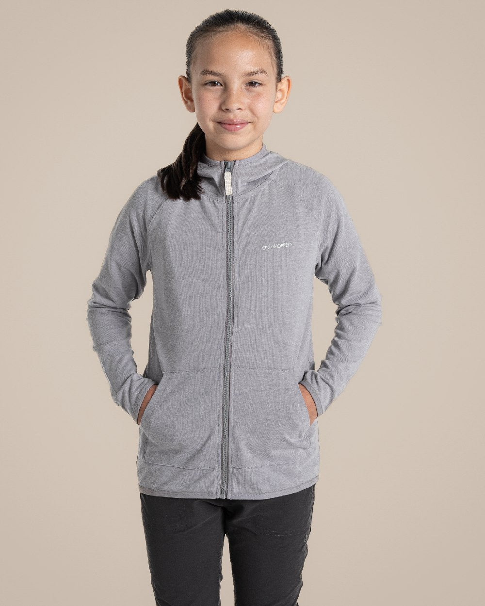 Soft Grey Marl Coloured Craghoppers Kids Nosi Life Frey Hooded Jacket on Beige Background