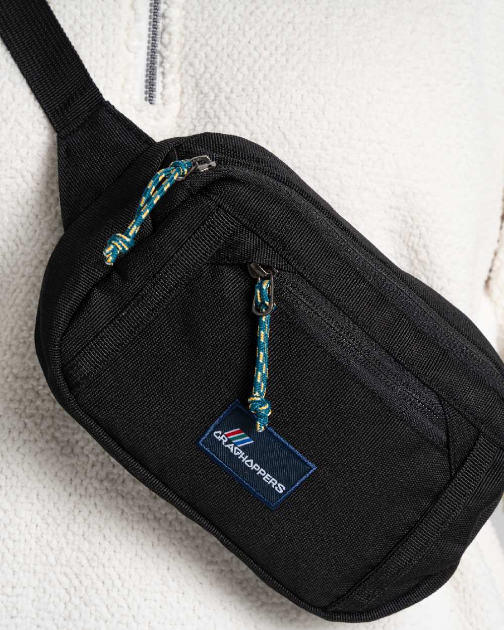 Black Coloured Craghoppers Kiwi Waistpack on Beige Background
