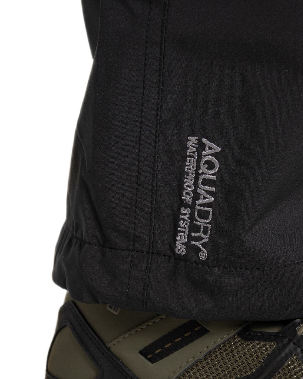 Black coloured Craghoppers Mens Indus Waterproof Lightweight Cargo Trousers on white background