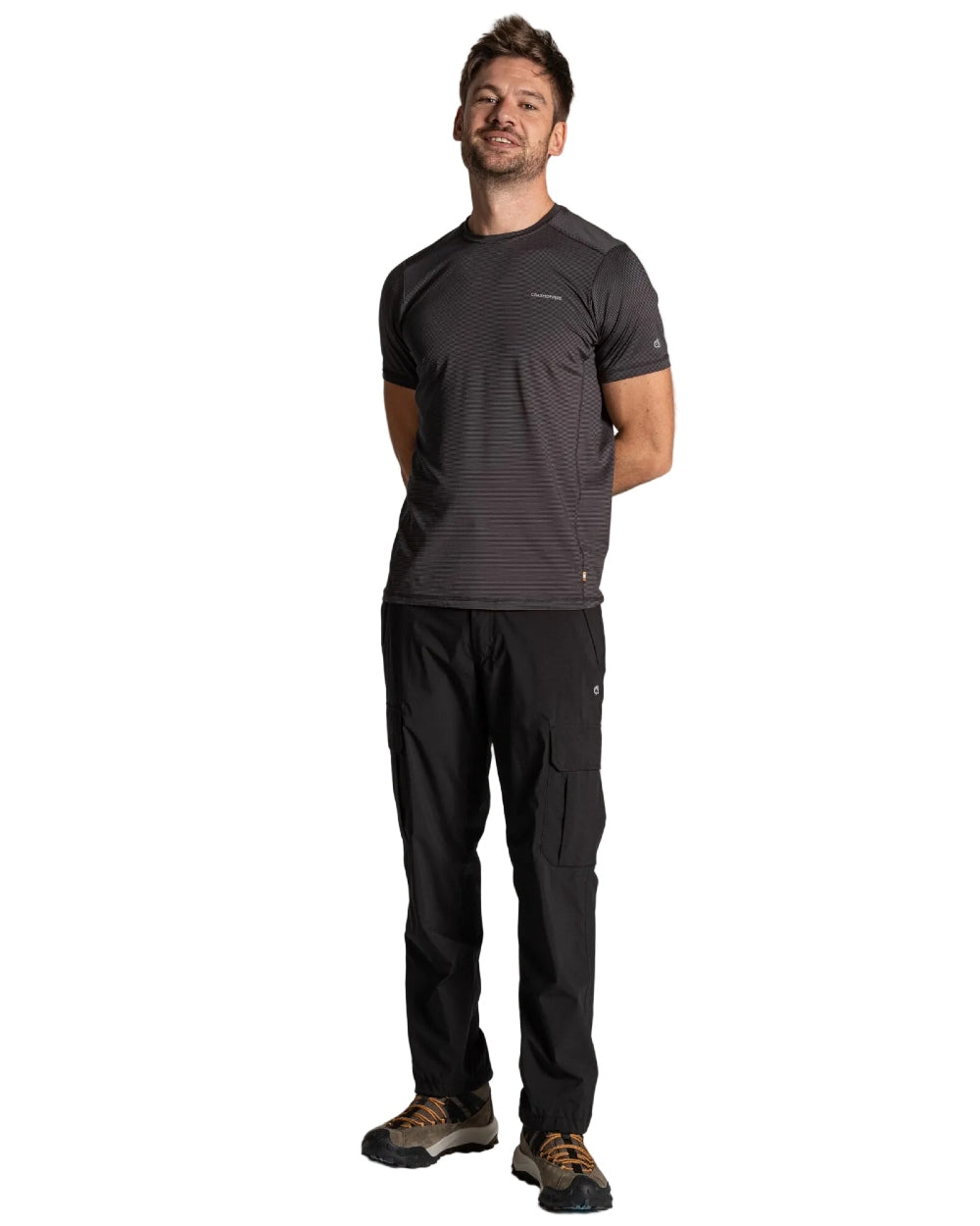 Black coloured Craghoppers Mens Indus Waterproof Lightweight Cargo Trousers on white background