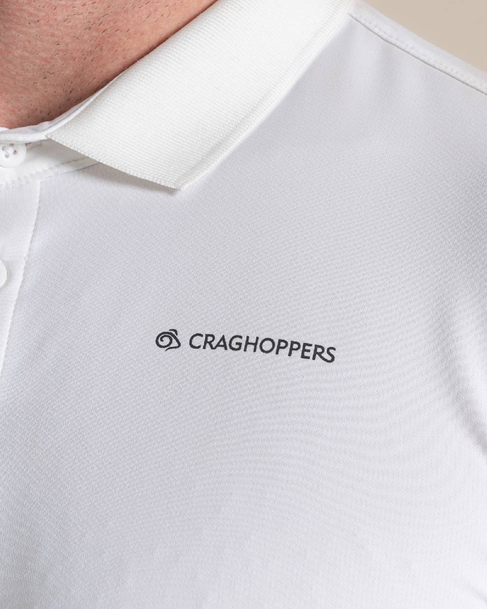 White Coloured Craghoppers mens Nosilife Bramshaw Long Sleeved Polo Top on Beige Background