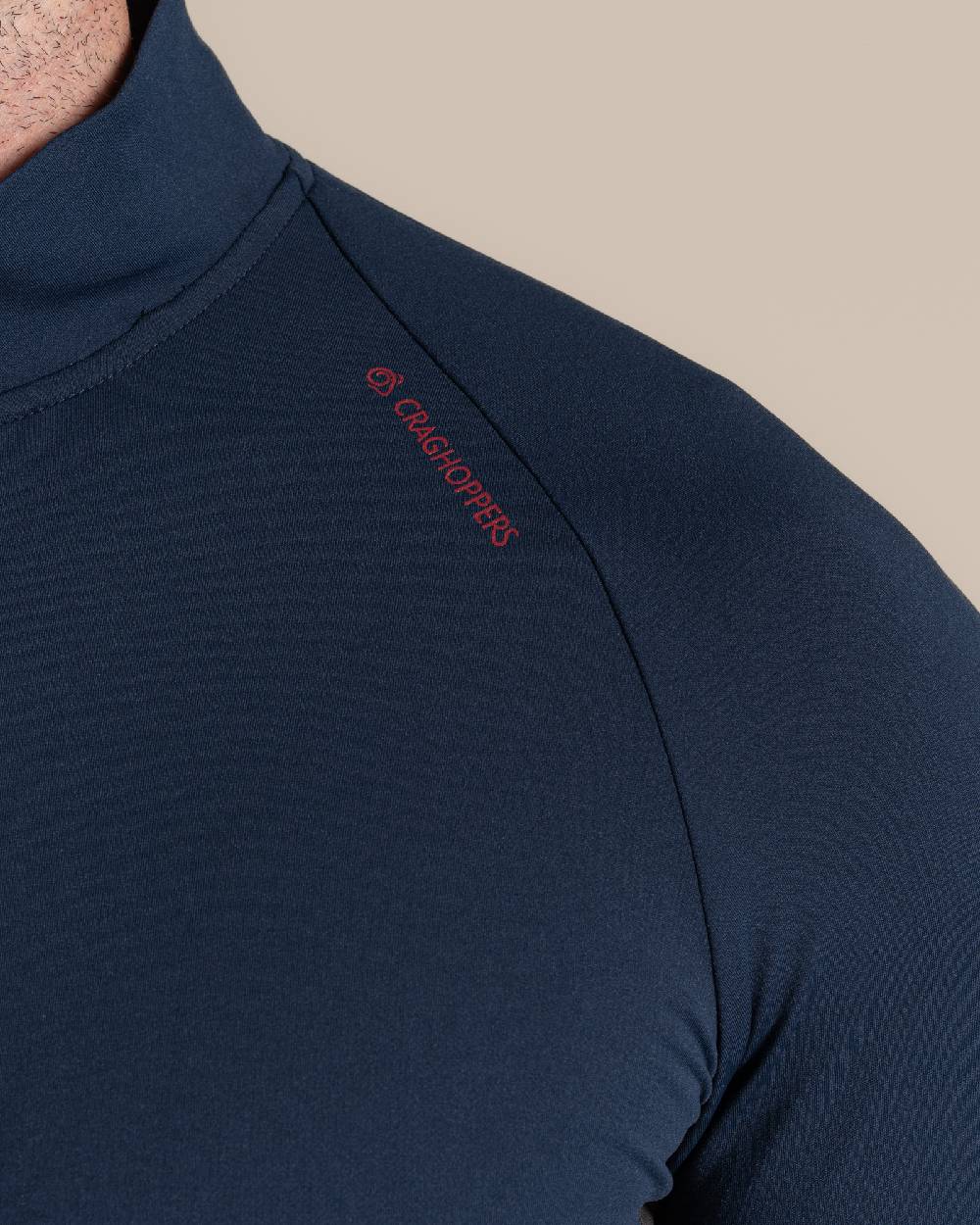 Blue Navy Coloured Craghoppers Mens Nosilife Goswick Half Zip Top on Beige Background