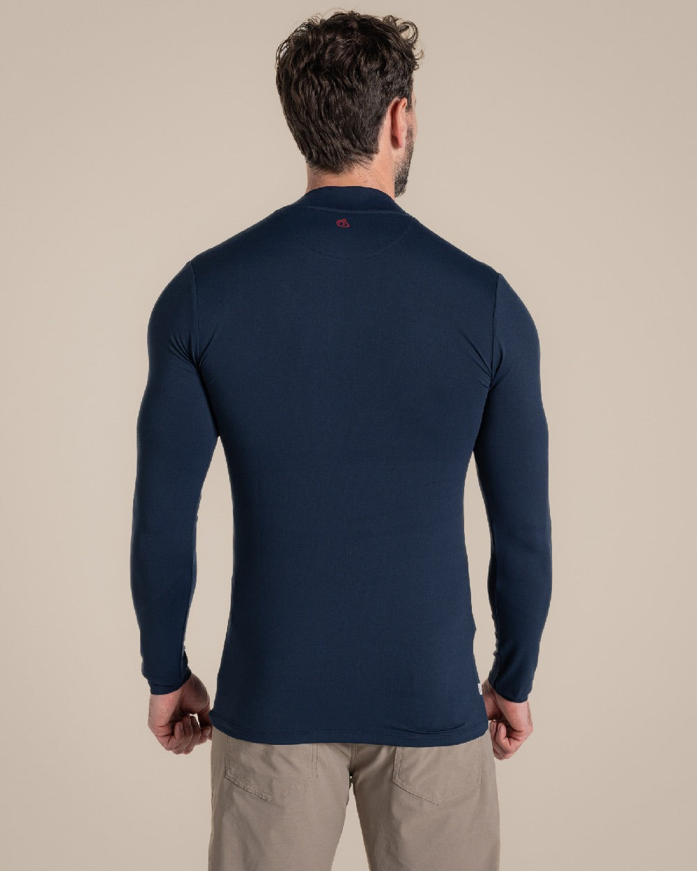 Blue Navy Coloured Craghoppers Mens Nosilife Long Sleeved Neck Top on Beige Background