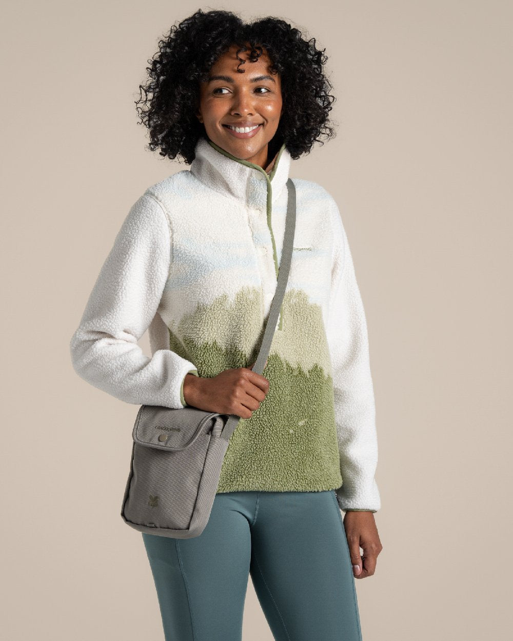 Vert Coloured Craghoppers National Trust Kiwi Crossbody on Beige Background