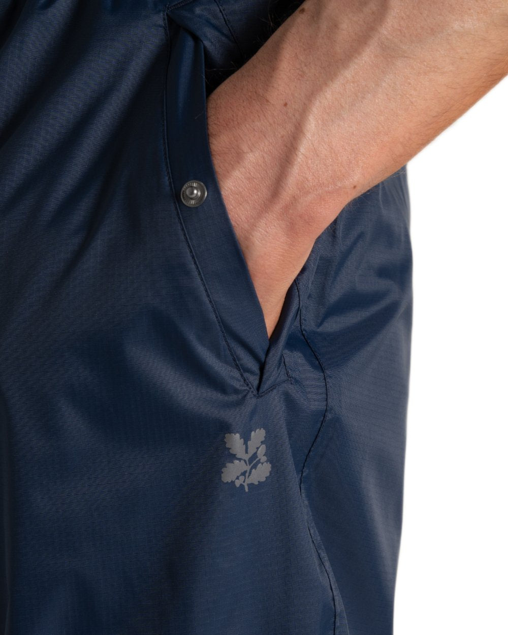 Blue Navy coloured Craghoppers Petterill Waterproof Packable Overtrousers on white background