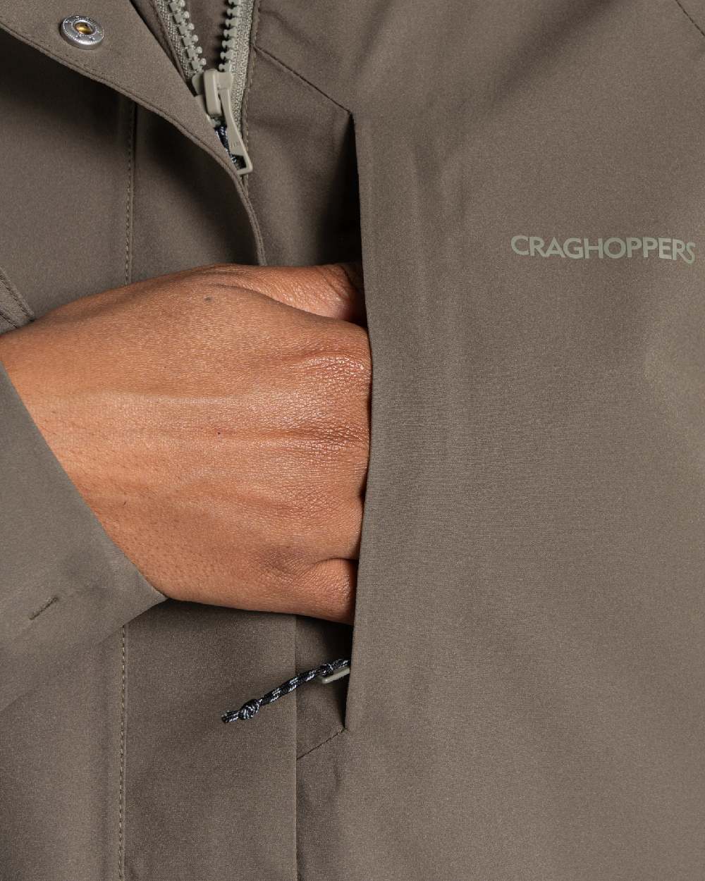 Wild Olive coloured Craghoppers Womens Caldbeck II Waterproof Jacket on white background