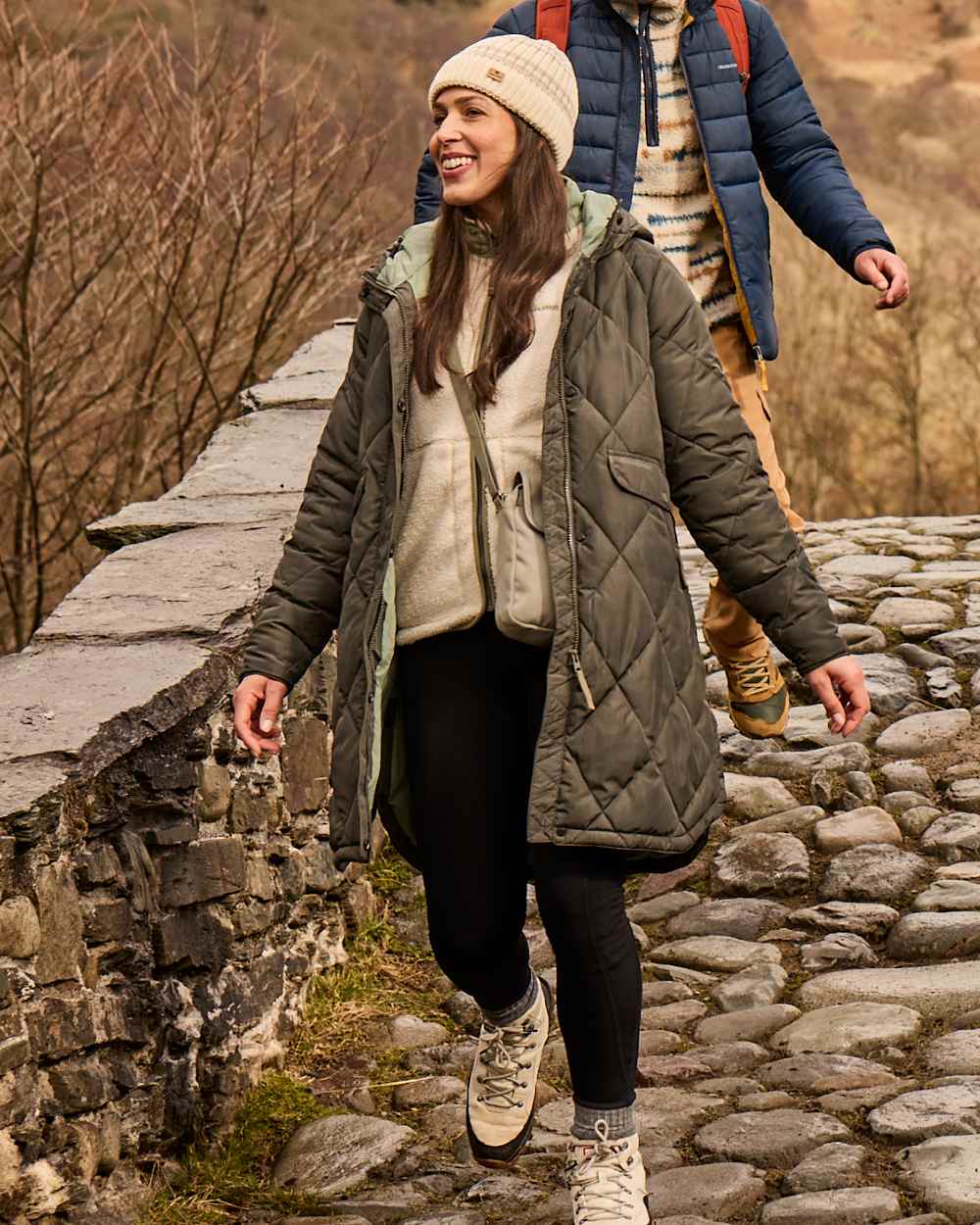 Black Coloured Craghoppers Womens Kiwi Pro Leggings On A forest Background